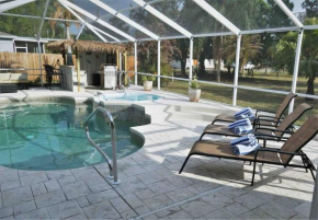 Peachland getaway with heated pool and tiki bar